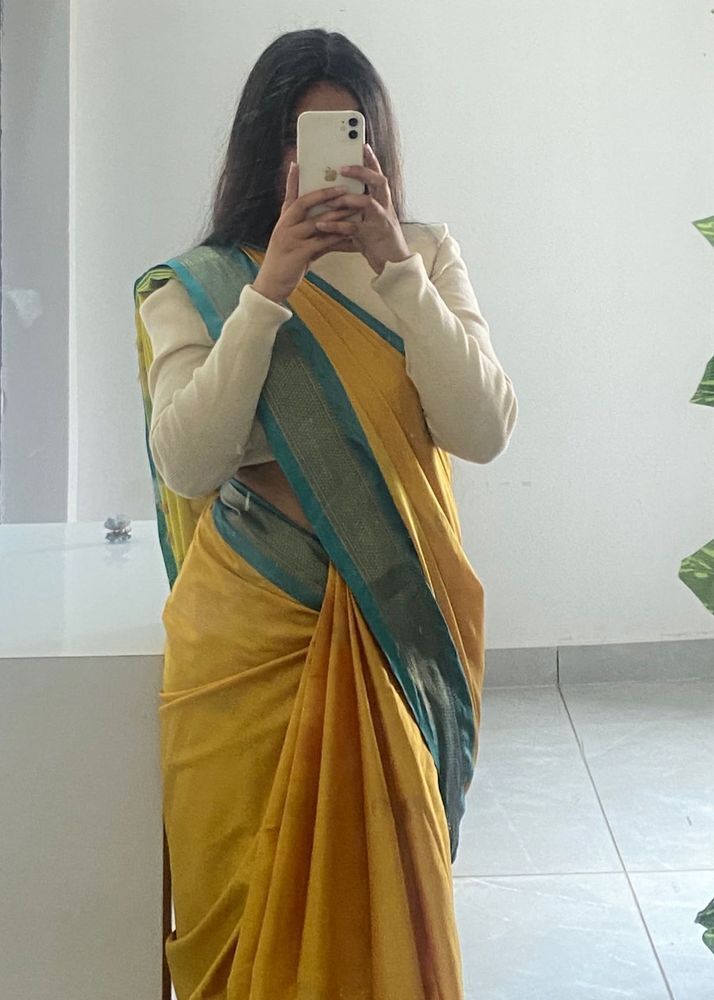Elegant Yellow Saree with Teal Border