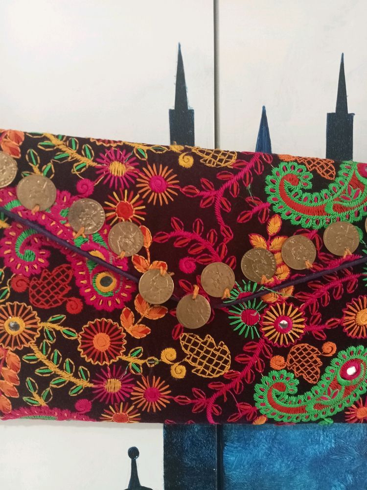 Embroidered Sling Bag.