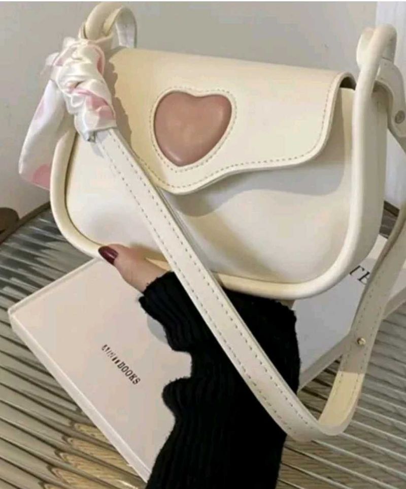 white handbag along with a cute ribbon 🎀