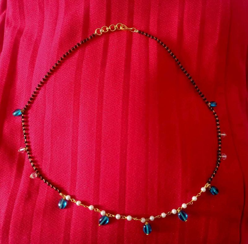 Elegant Black Bead Necklace with Blue Accents