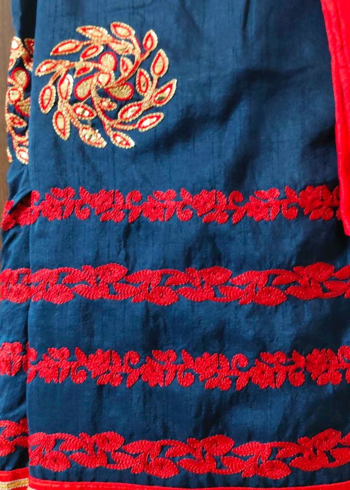 Elegant Blue Saree with Red Embroidery desig