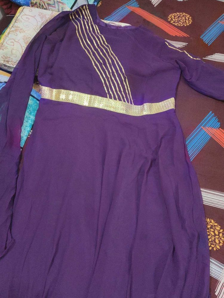 Elegant Purple Gown with Gold Embellishments