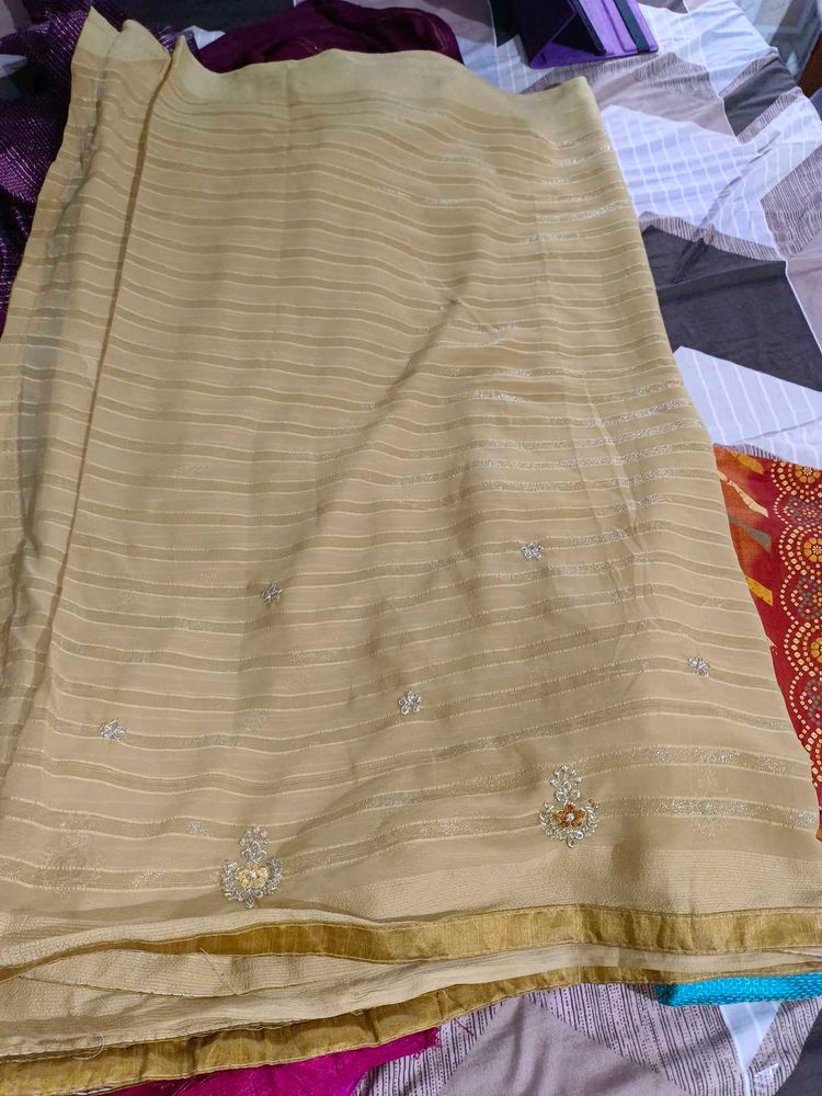 Elegant Cream Striped Saree with Embellishments