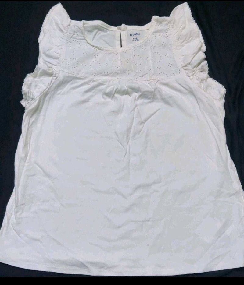 White eyelet detail top