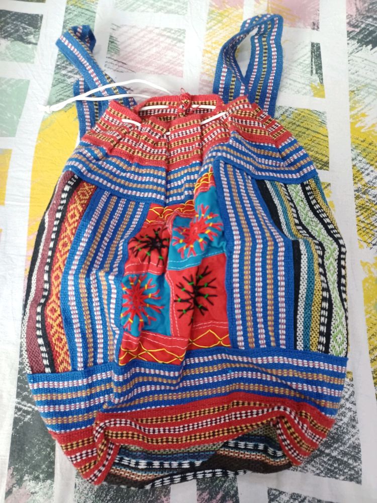 Embroidered bag pack lovely for travel and trendy. Totally unused.