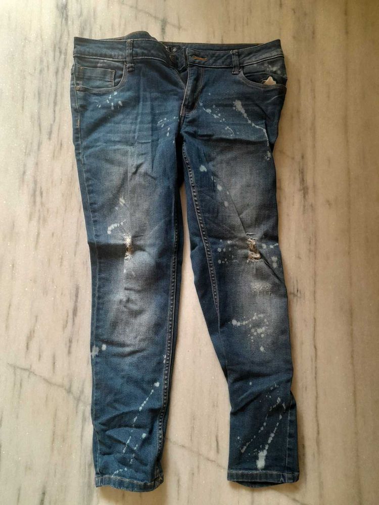 Distressed Blue Jeans with Paint Splatter