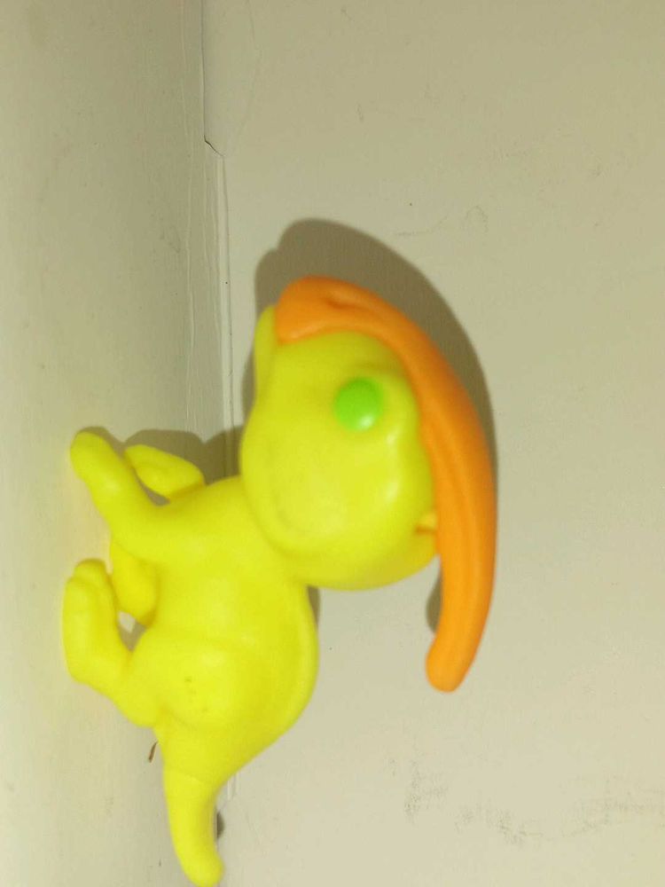 Yellow Toy Figure with Orange Hair