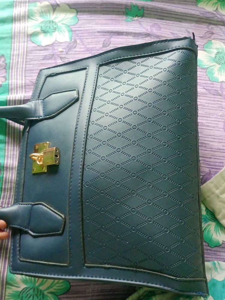 Stylish Teal Handbag with Gold Lock