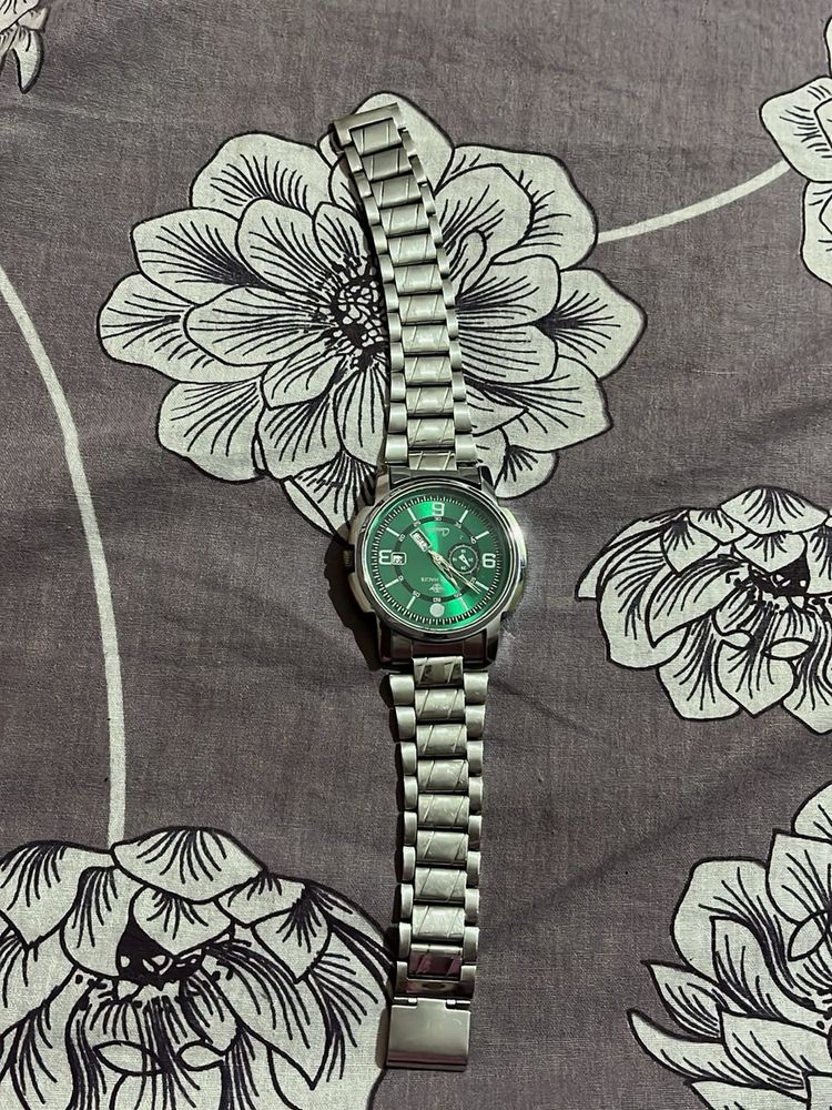 Green dial wrist watch