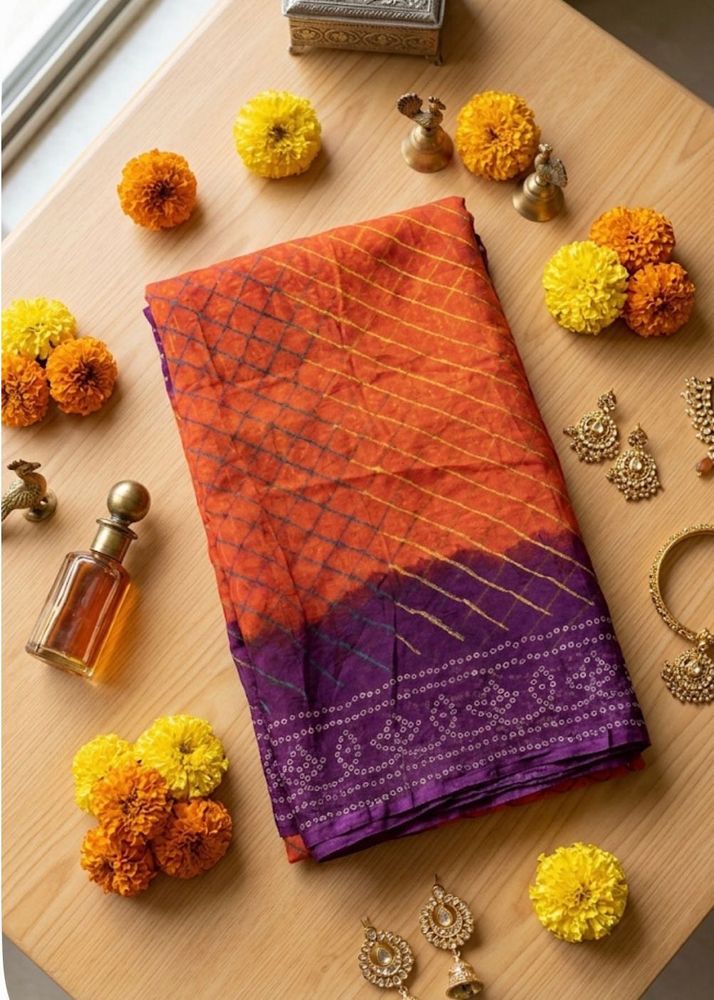 Lovely orange and purple bandhej Saree
