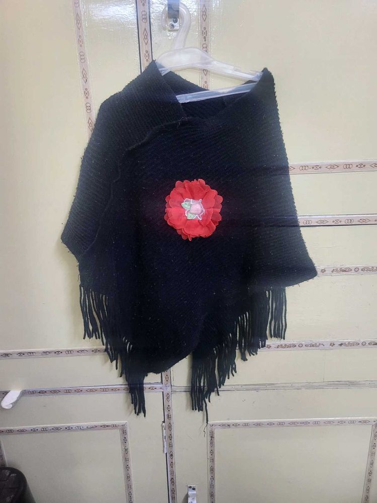 Chic Black Poncho with Red Flower Accent