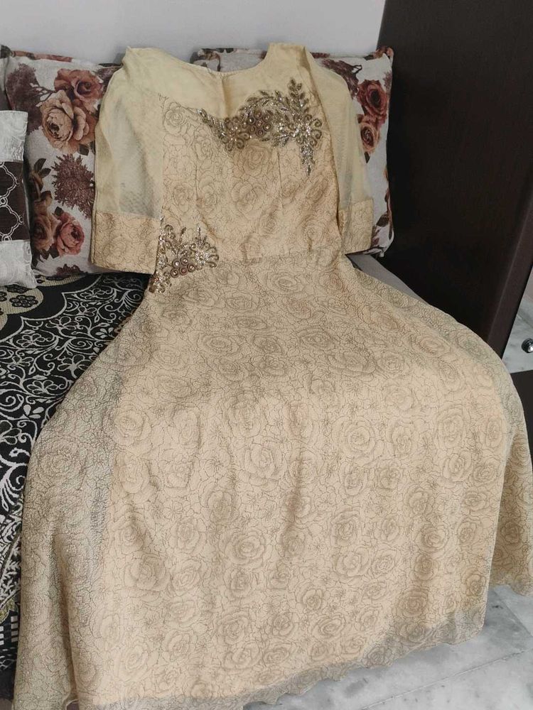 Elegant Beige Embroidered Gown