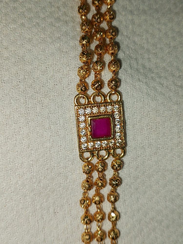 Elegant Gold and Pink Stone Bracelet