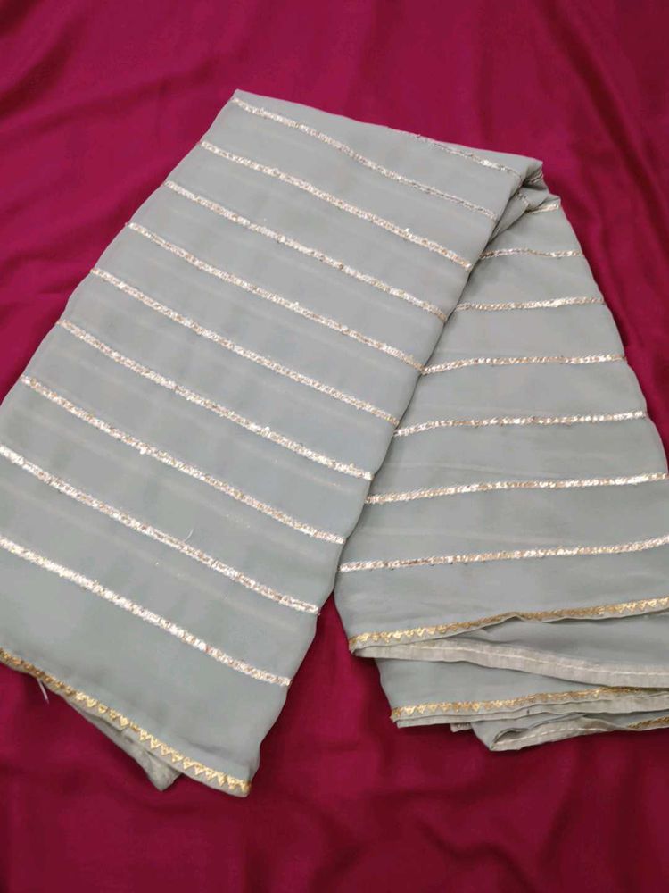 Elegant Grey Saree with Golden Stripes