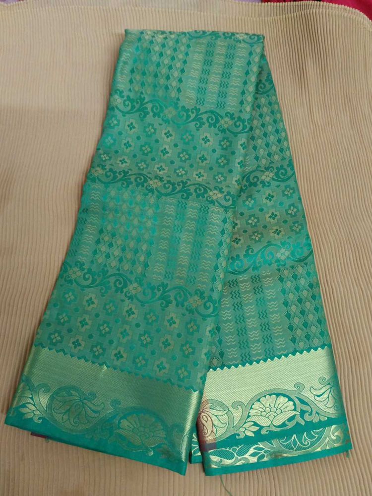 Green Embossed Soft Silk Saree
