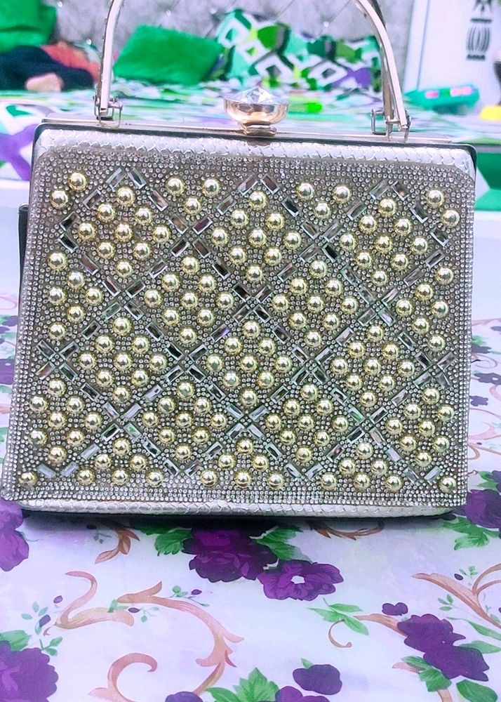 Elegant Beaded Silver Clutch