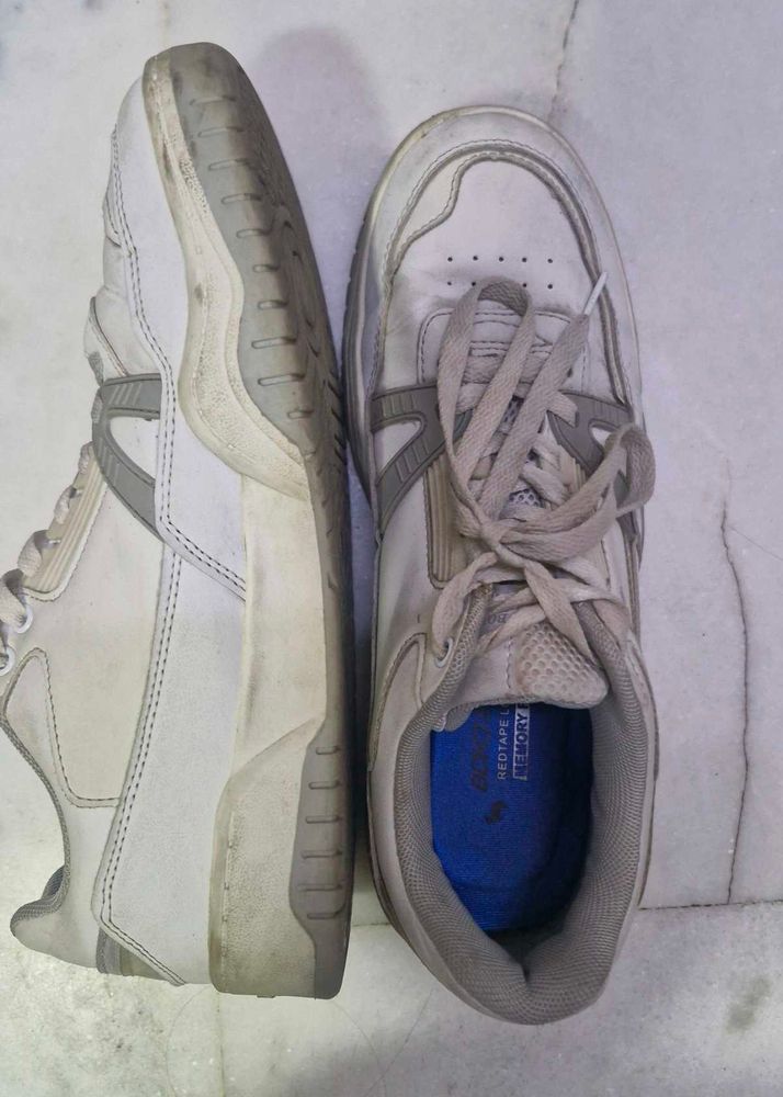 Worn White Sneakers