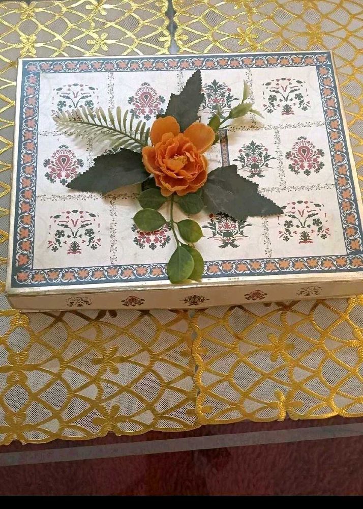 9. Decorative Gift Box with Floral Accent