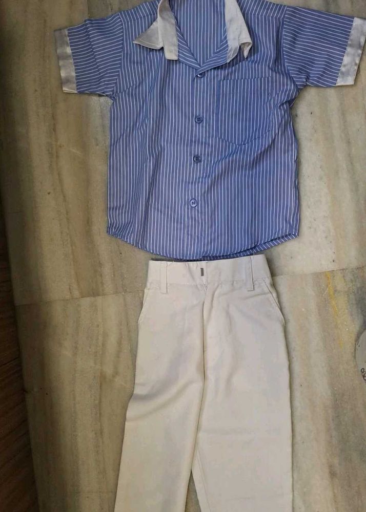 short-sleeve blue  striped  shirt  and white trous