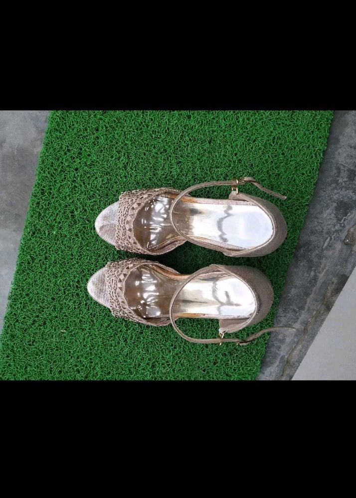 Golden colour beautiful heel
