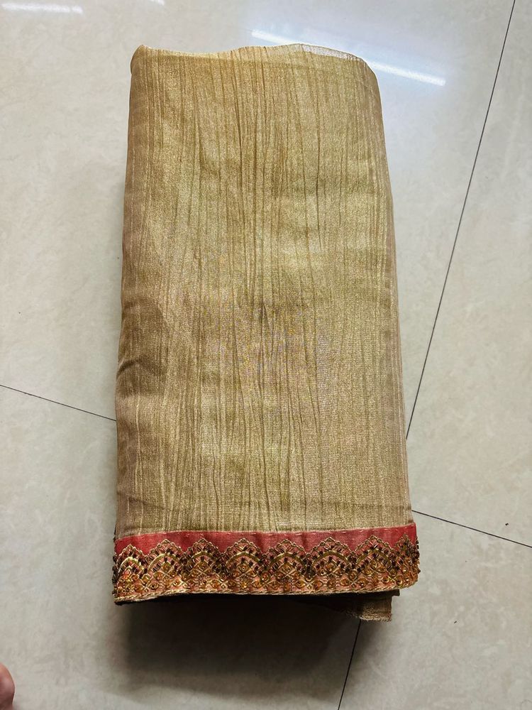 Elegant Gold Saree with Pink Border
