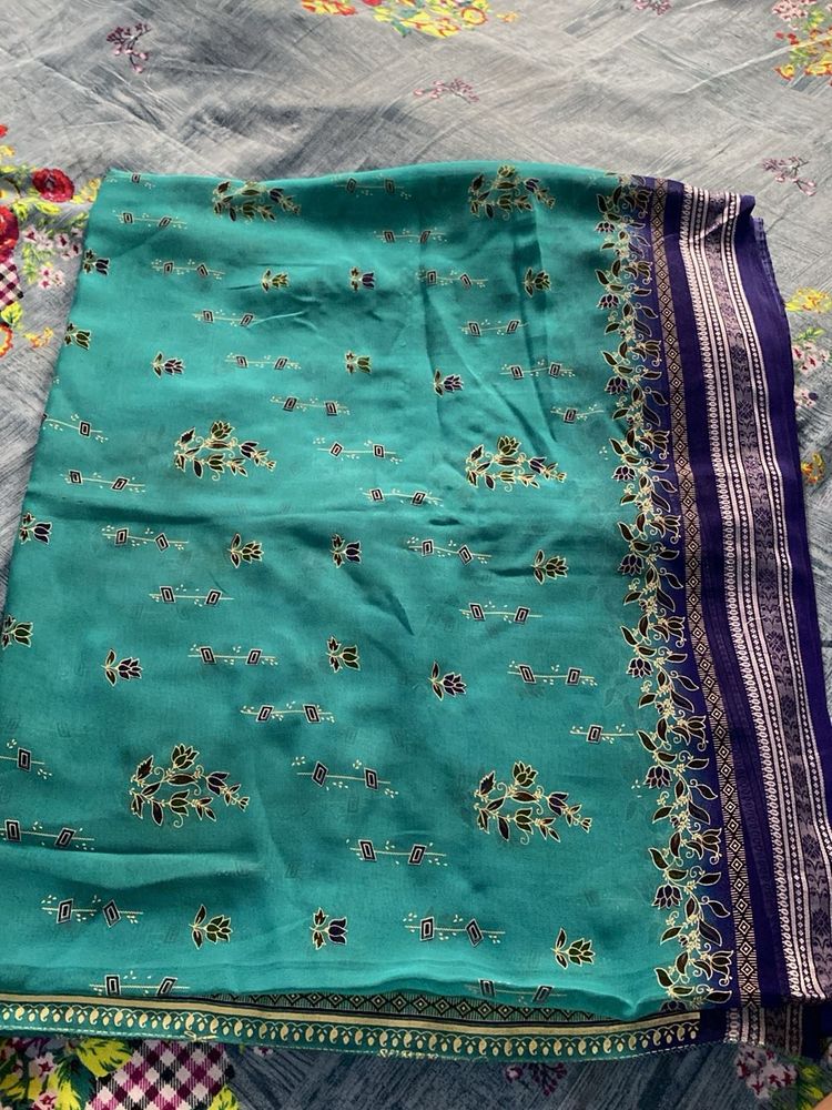 Teal Saree with Floral Motifs