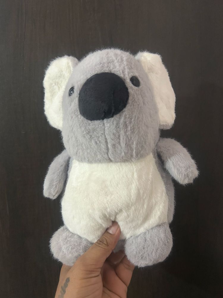grey and white koala plush toy featuring a large