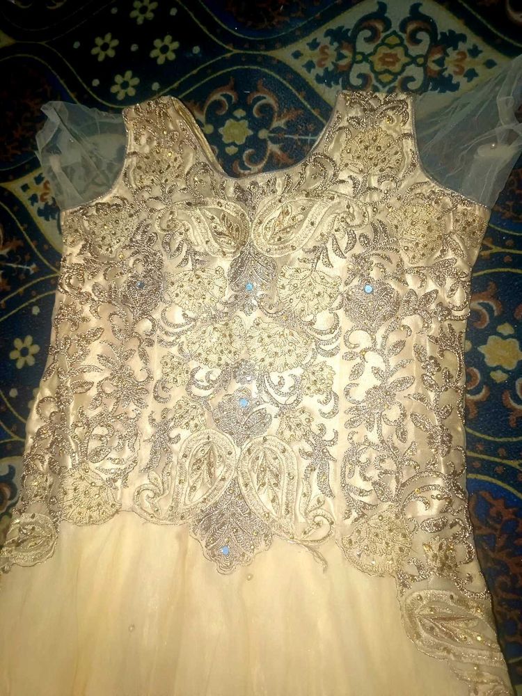 Elegant Cream Gown with Embellished Bodice