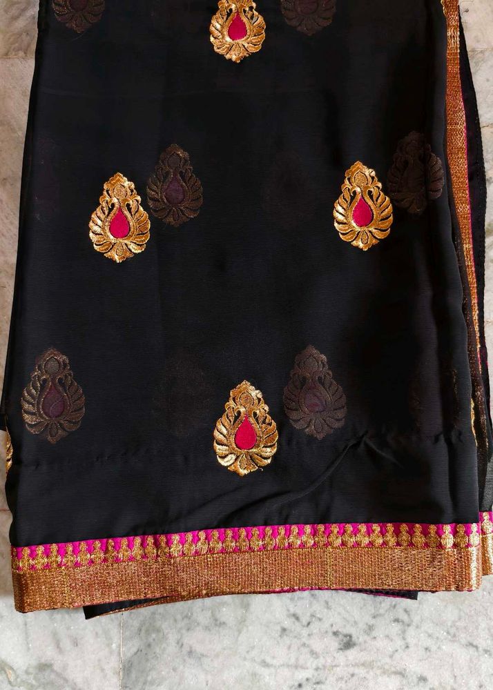 Elegant Black Saree with Gold Embellishments