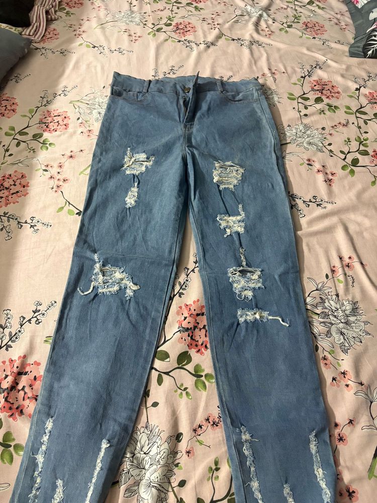 Distressed Blue Denim Jeans