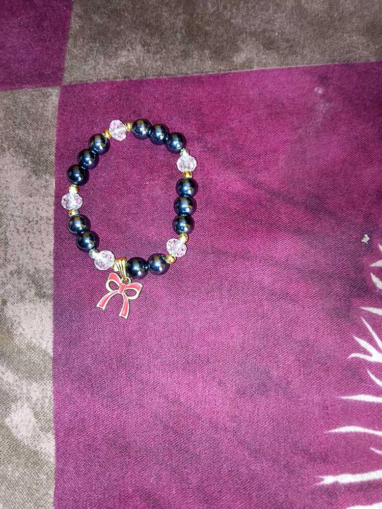 Charming Beaded Bracelet with Bow Charm