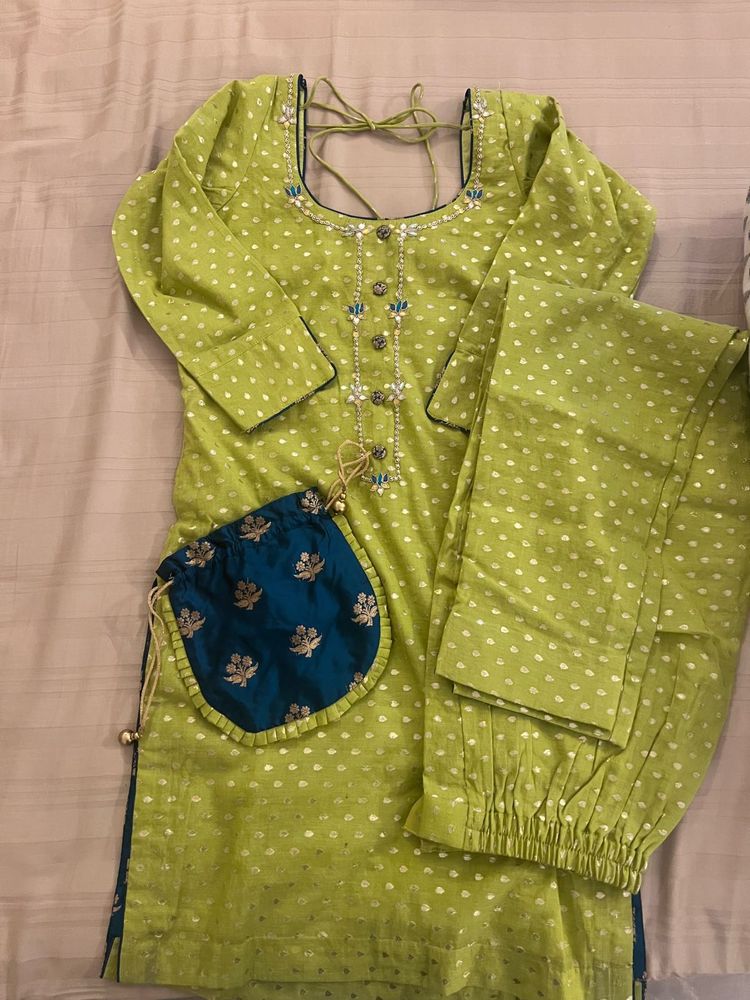 Beautiful Green Kurta and Pant with matching Potli