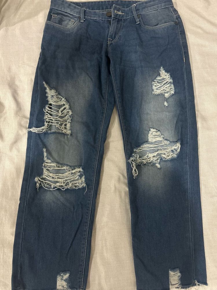 Distressed Blue Denim Jeans