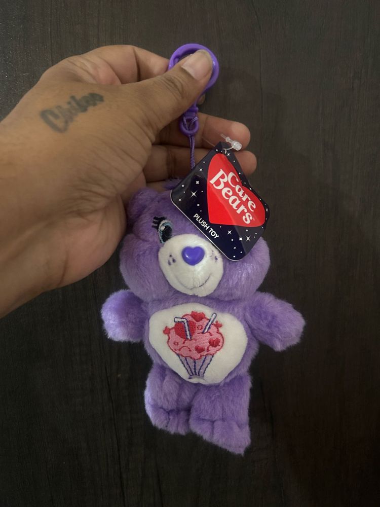 purple Care Bears plush toy keychain featuring