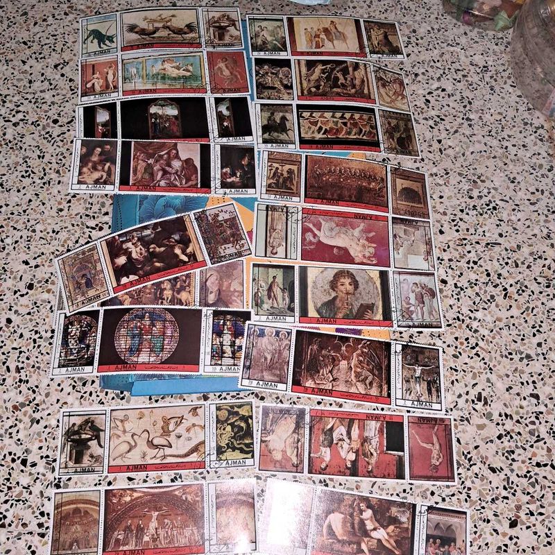 Collection of 54 vintage AJMAN painting stamps.