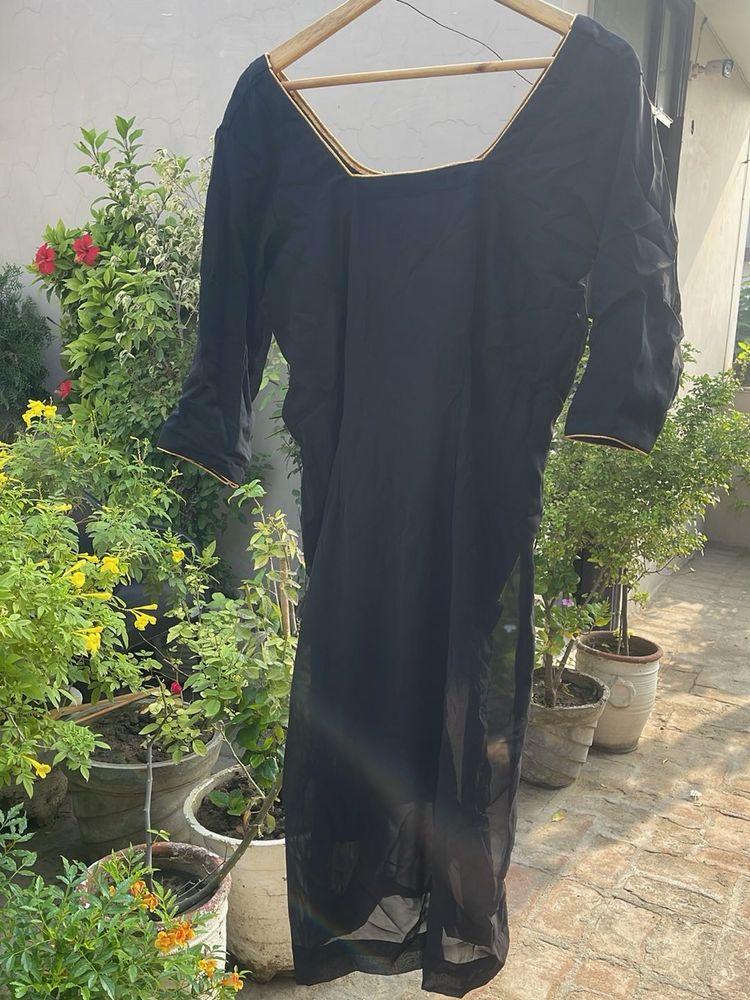 Elegant Black Blouse with Gold Trim