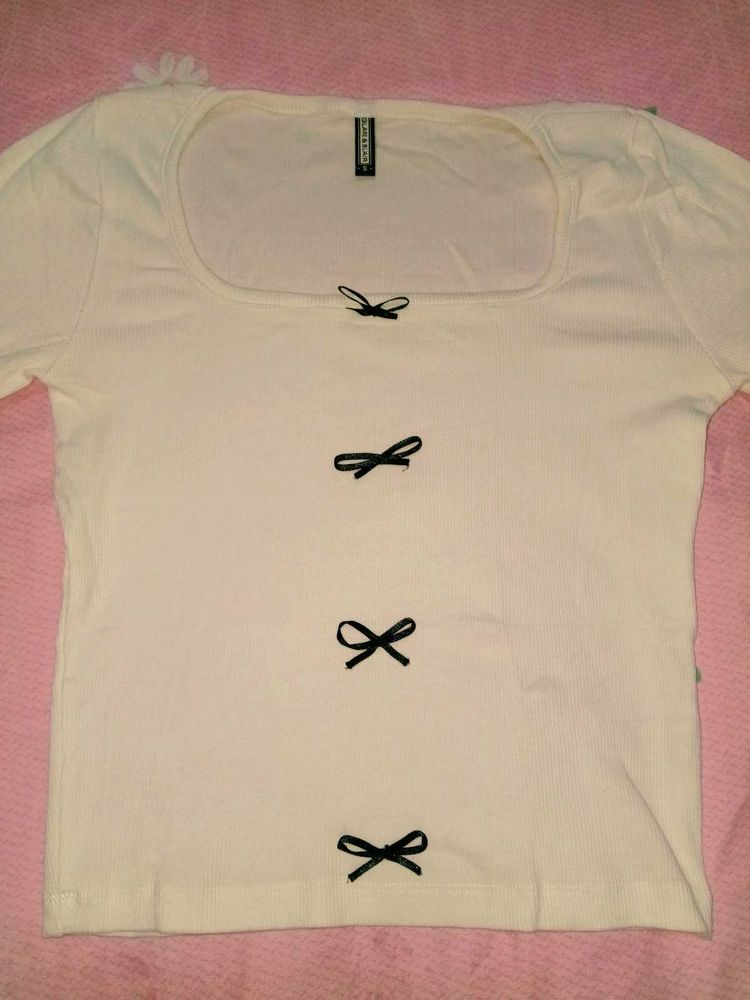 Cream Ribbed Top with Black Bows