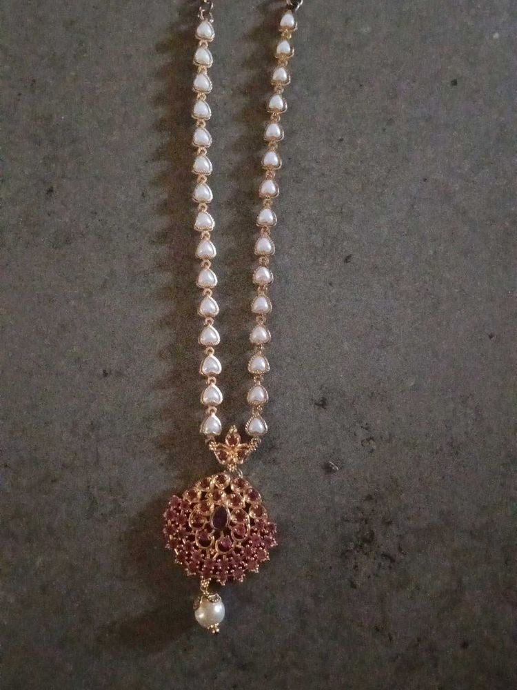 Elegant Pearl Necklace with Red Stones