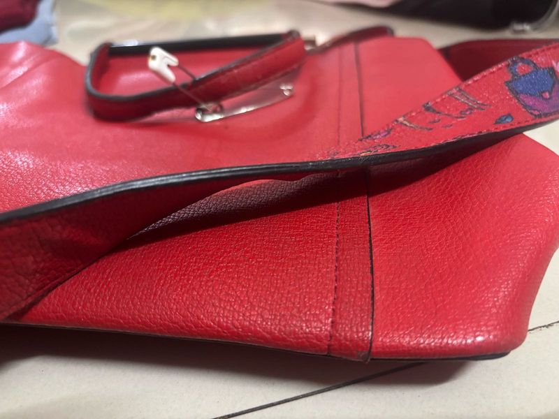 Vibrant Red Handbag with Unique Strap