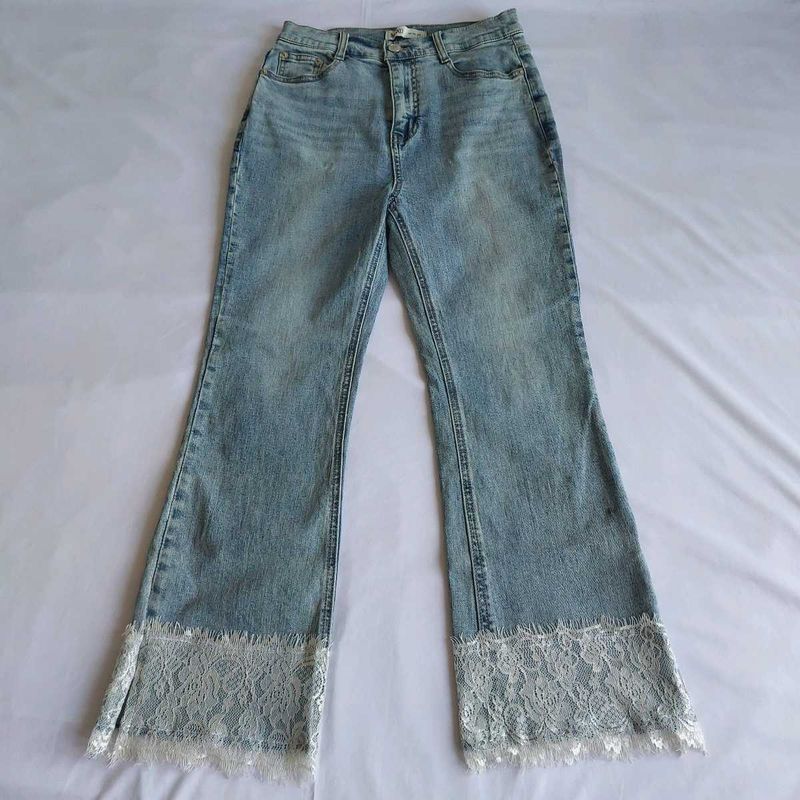 Light Wash Flared Jeans with Lace Trim