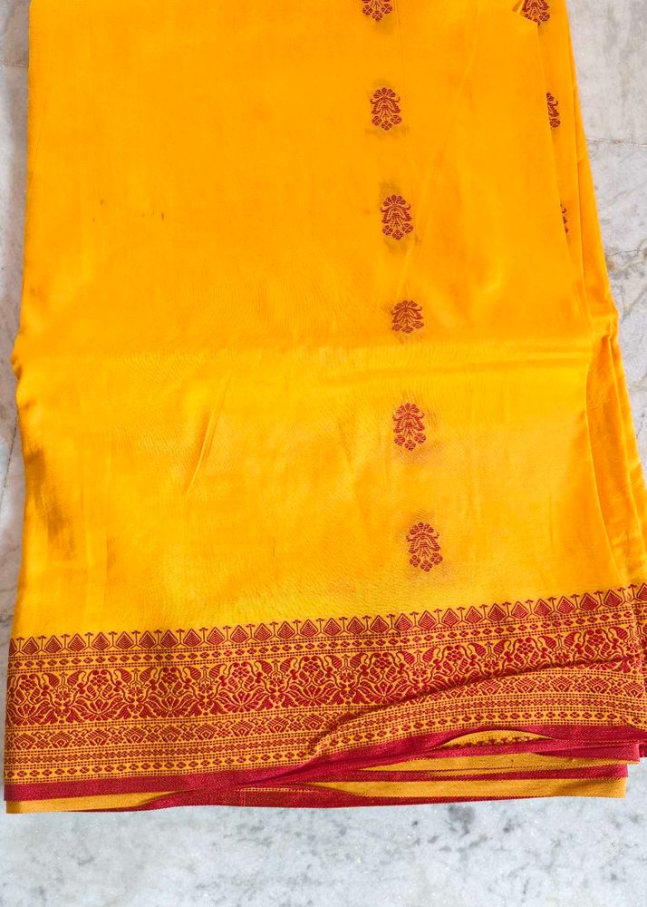 Vibrant Yellow Saree with Red Border