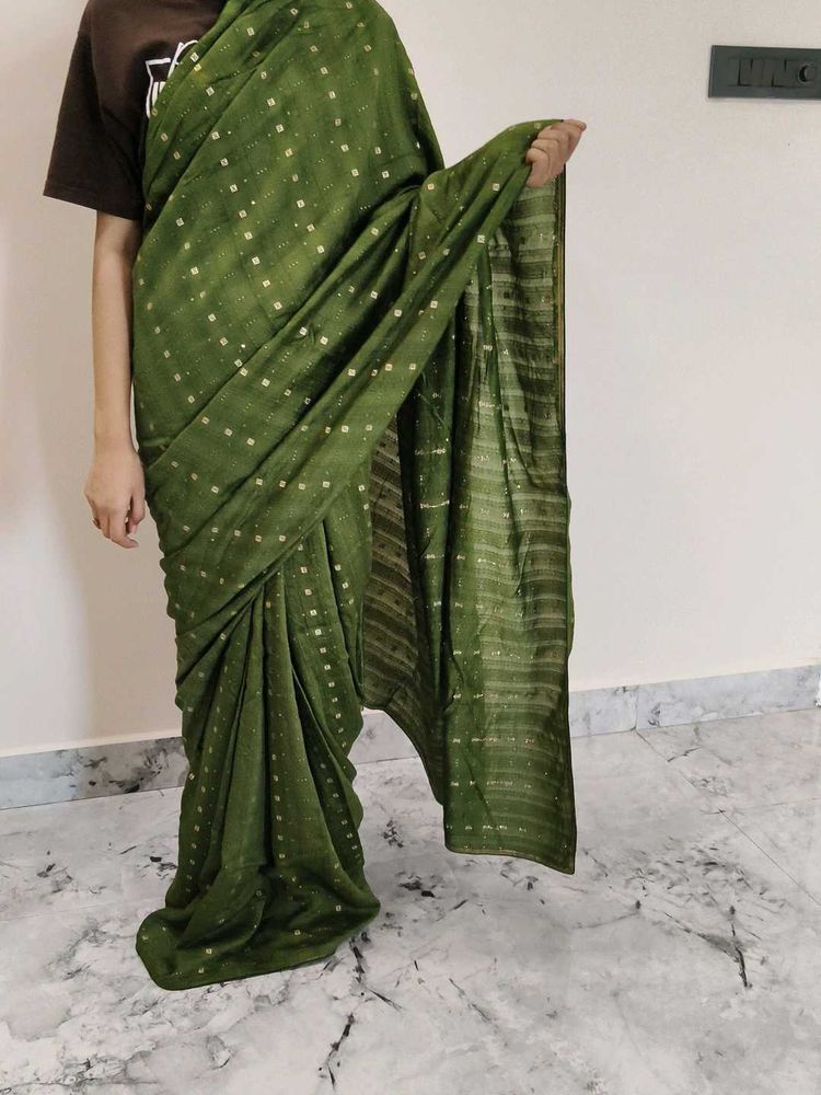 Elegant Green Saree with Gold Accents