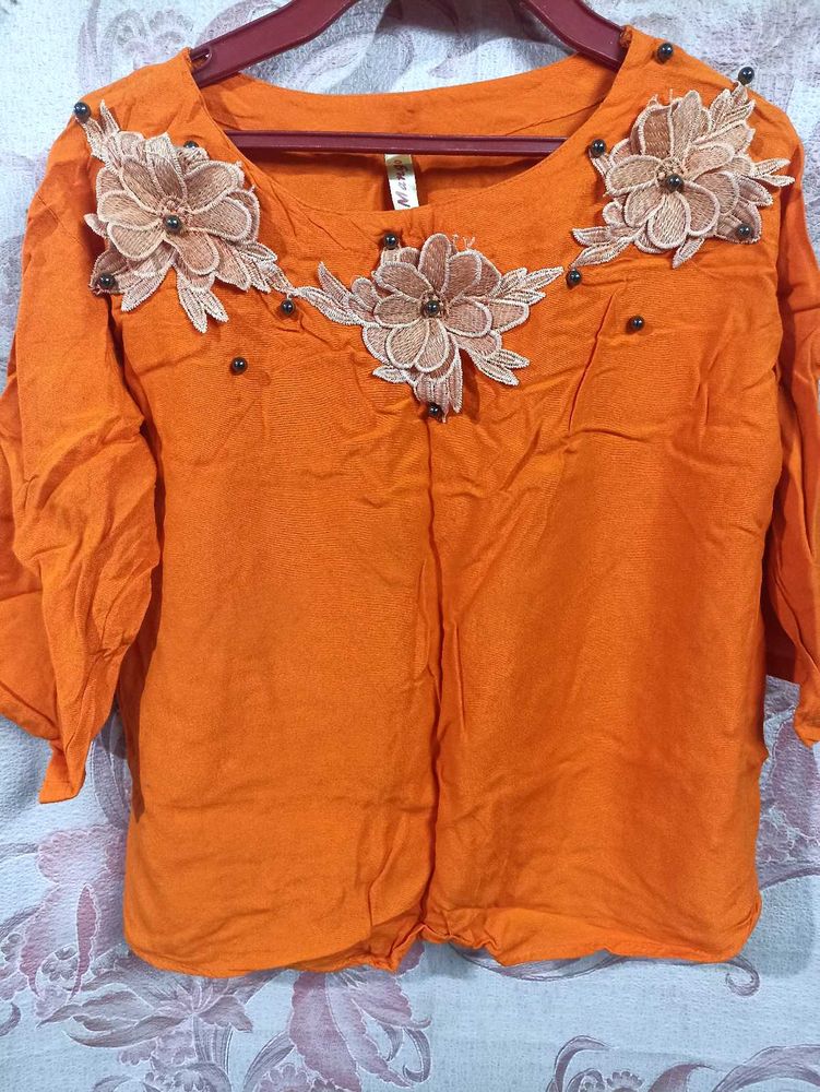Vibrant Orange Kurta with Floral Embellishments