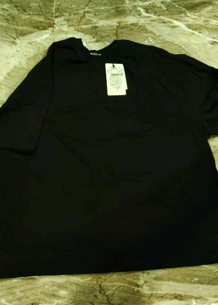 m size  Black "The World Needs Your Magic" T-