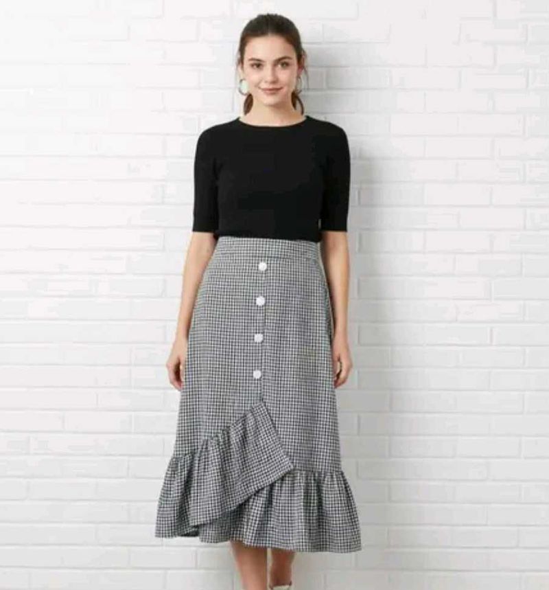 Black and white checked skirt.