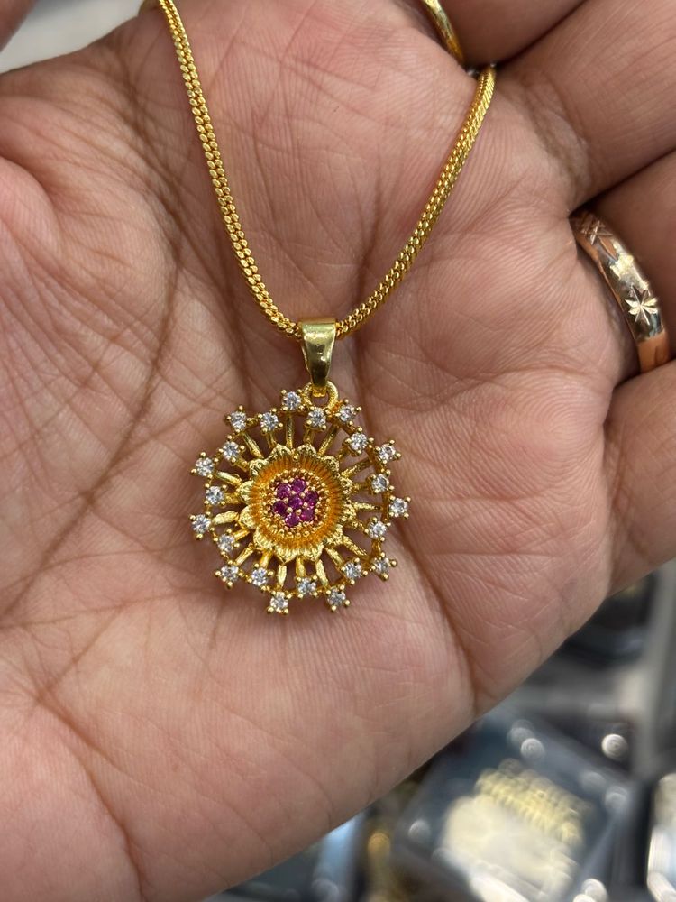 Elegant Gold Pendant with CZ Stones