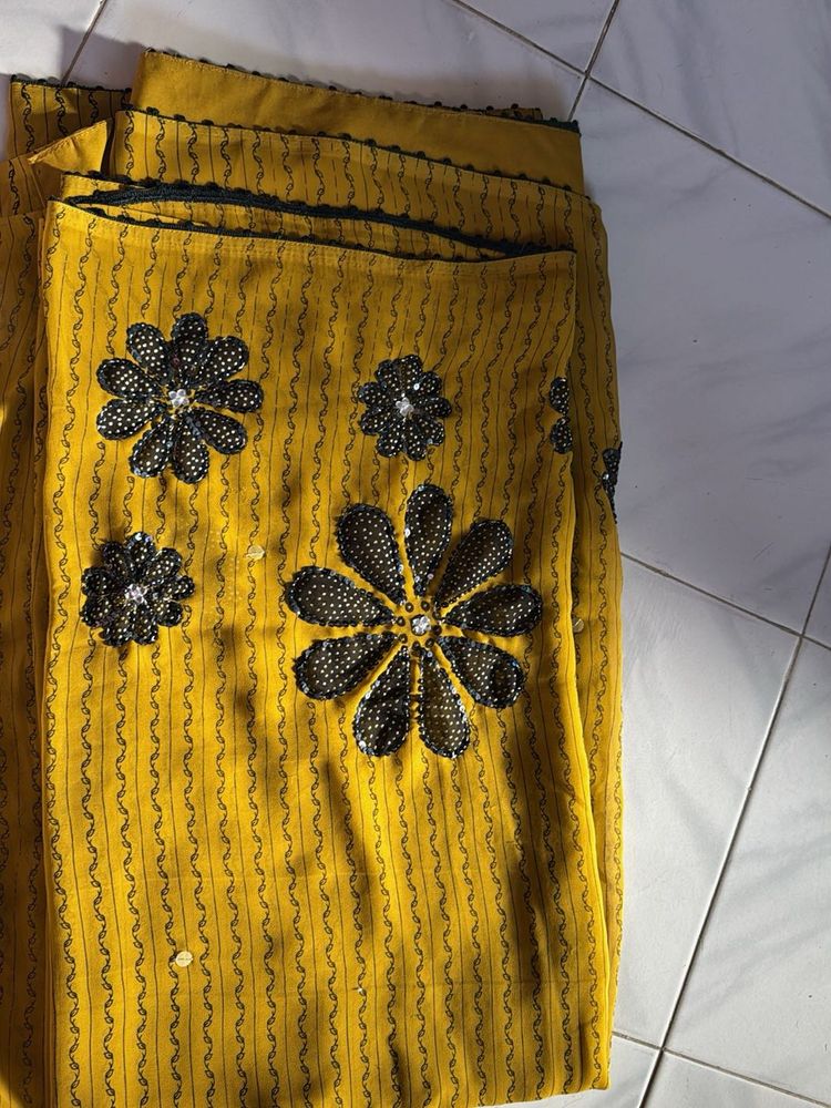 Yellow Saree with Floral Embellishments