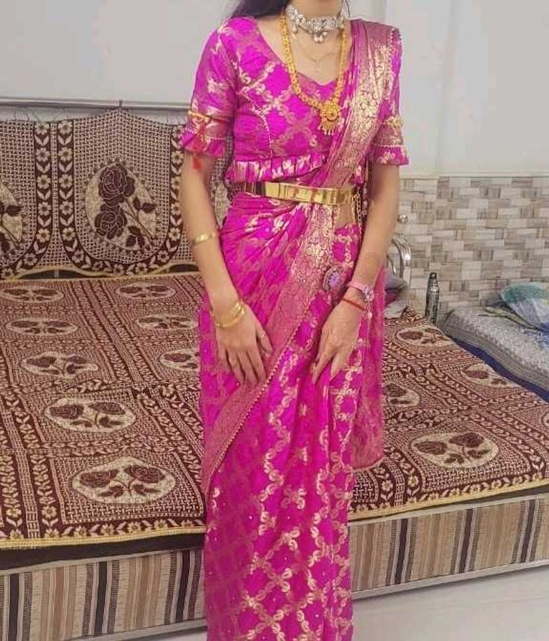Vibrant Pink Saree with Golden Motifs