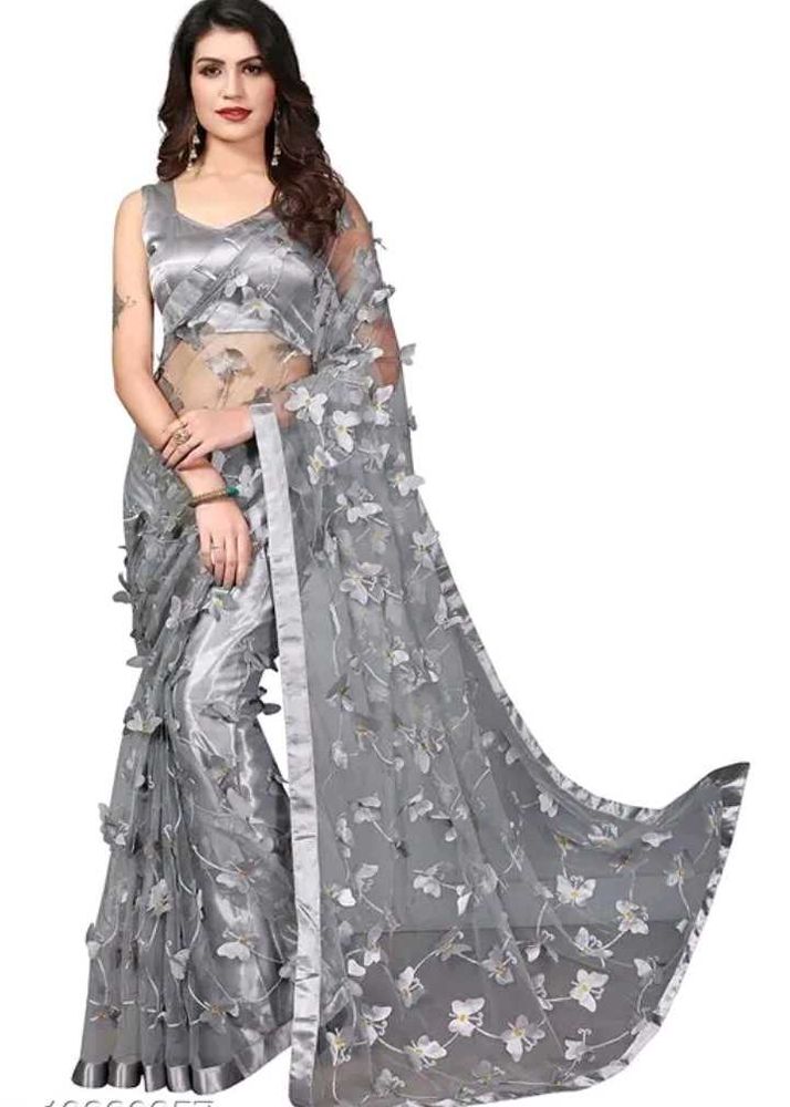 Gray net saree with butterfly patch work.