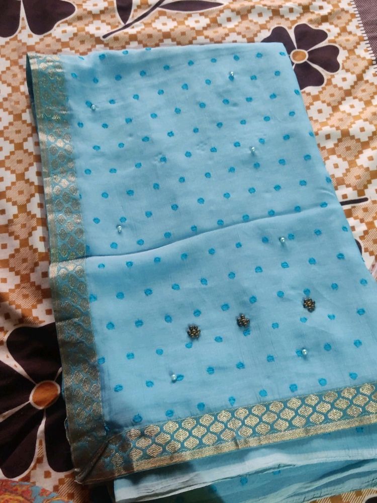 A Nice Sky Blue Saree With Beads